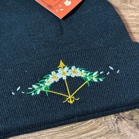 Black Odds In Your Favor Beanie with Floral Design | Hunger Games | Owlcrate - Picture 2 of 5